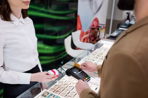 Retail associate assisting a customer at checkout
